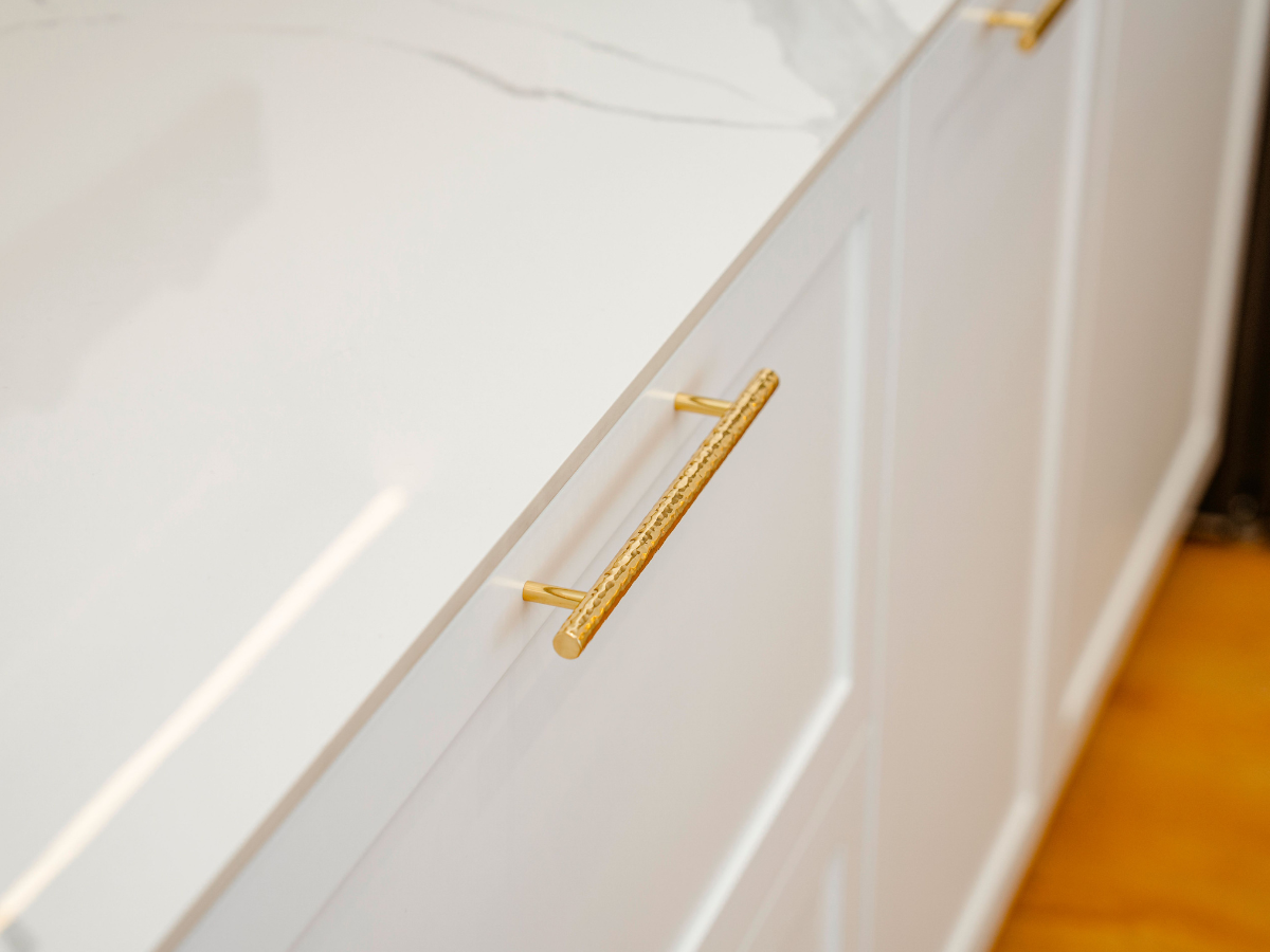 Kitchen cabinet with gold hardware
